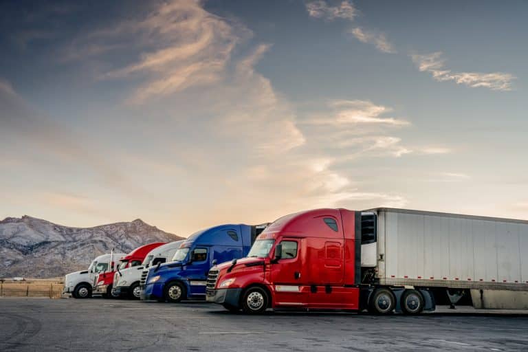 Red, white, and blue trucks lined up