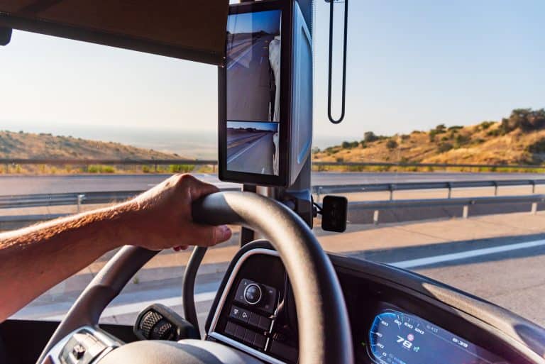 Student gripping steering wheel on commercial truck